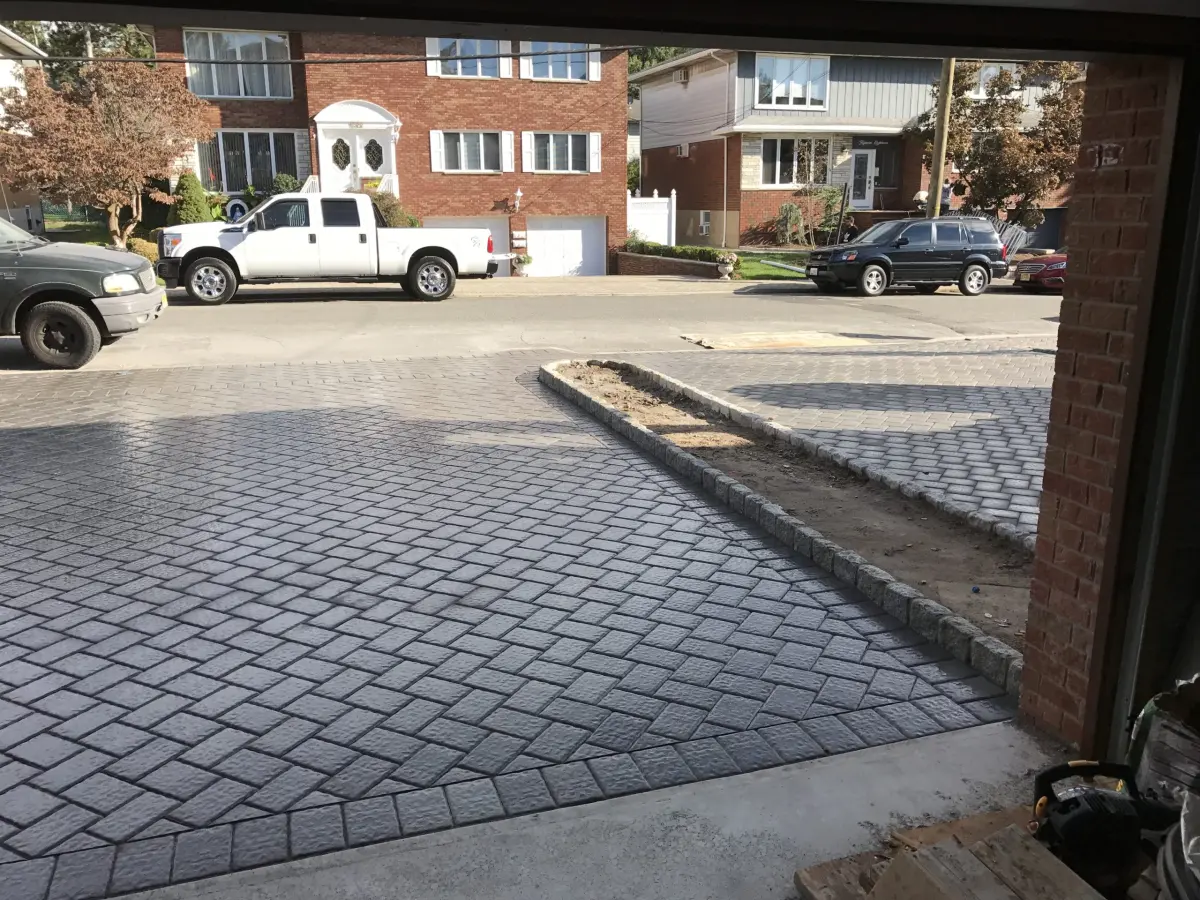 Paver driveway with a narrow central planting bed