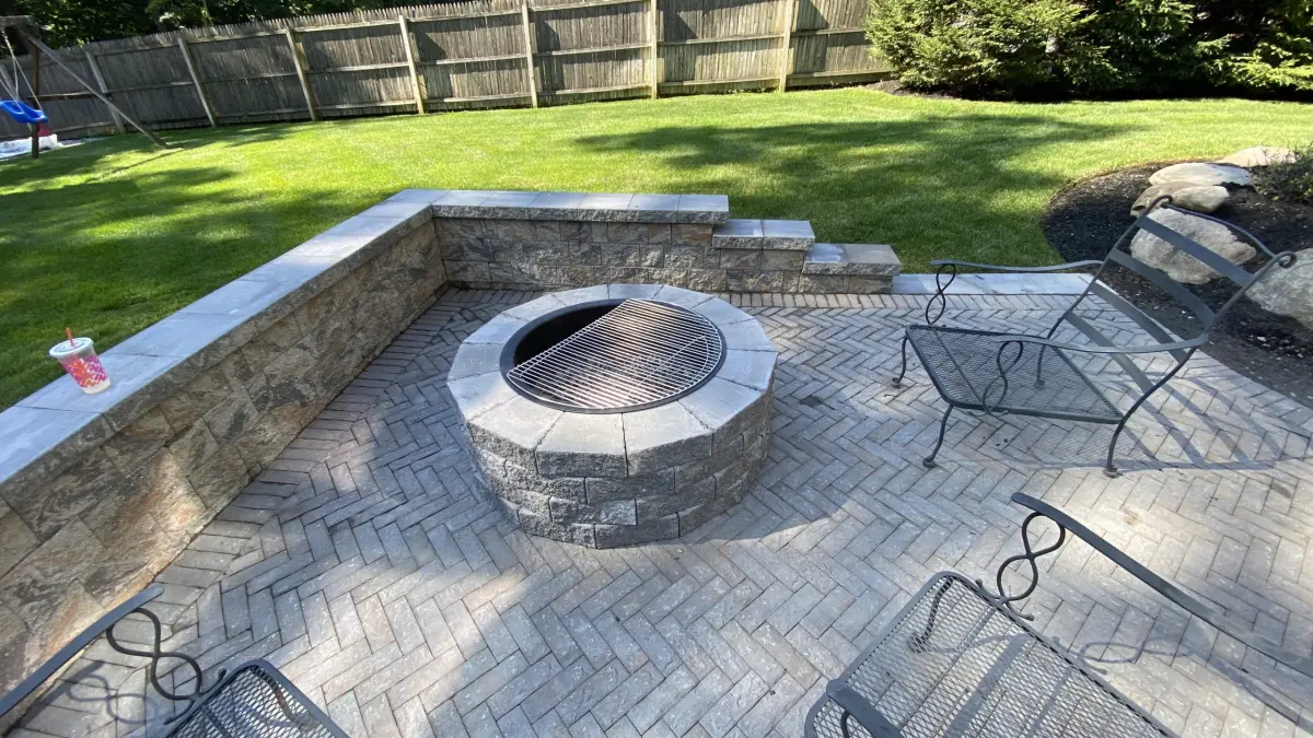 Round stone fire pit with nearby seating