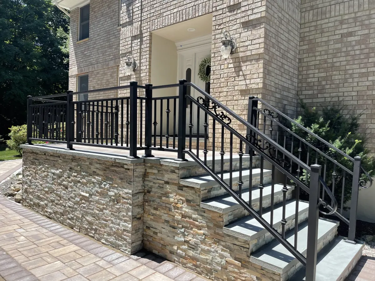 Masonry front steps connecting to a paver walk